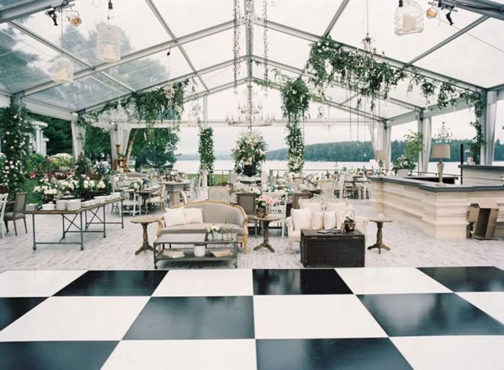 image alt text: a black and white tented outdoor winter wedding reception setup